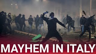 Italy rocked by chaotic scenes as rioters clash with police leaving over 100 officers injured