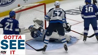 GOTTA SEE IT: Jets' Hellebuyck Cut By Kucherov Slap Shot To Face