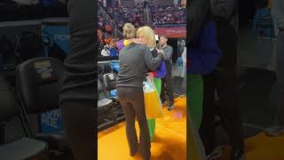 Kim Mulkey gives Kim Caldwell a baby present