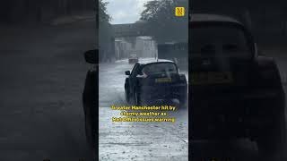 Moment heavy rain batters Greater Manchester