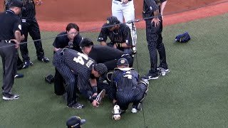 折れたバットが直撃した曽谷、倒れたまま動けず。場内騒然となる。