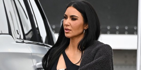 Kim Kardashian Goes Full Showgirl in a Jewel-Covered, Corset-Style Bodysuit and Feathered Headdress