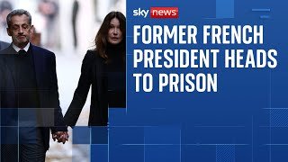 Nicolas Sarkozy walks with Carla Bruni on way to begin five-year prison term