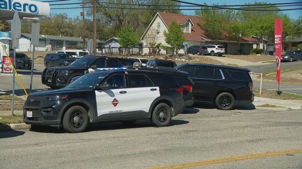 Handcuffed suspect found with head gunshot in back of police car after chase