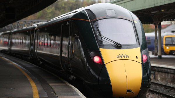 Train lines reopen after car crashes into railway bridge