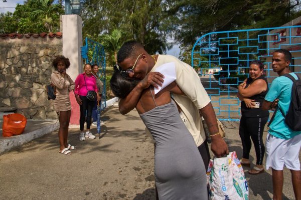 Photos of freed prisoners reuniting with families outside a Cuban prison